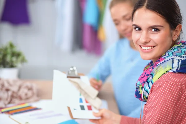 Modern young fashion designers working at studio. — Stock Photo, Image