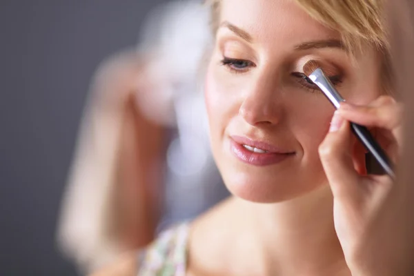 Artist doing professional make up of woman — Stock Photo, Image