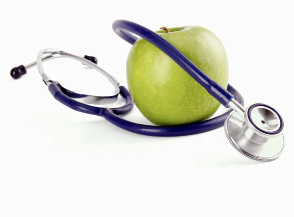 Medical stethoscope and apple, isolated on white background — Stock Photo, Image