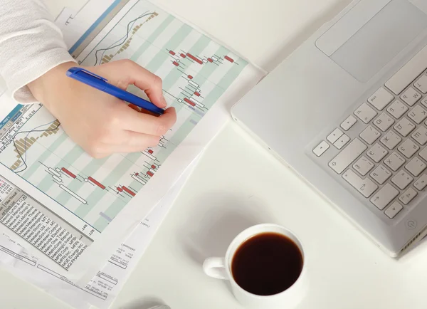 A woman at the desk write on a paper, isolated on white — Stock Photo, Image