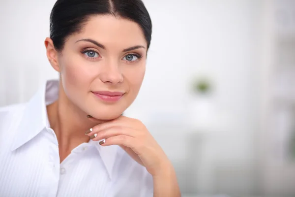 Attractive businesswoman sitting  in the office — Stock Photo, Image