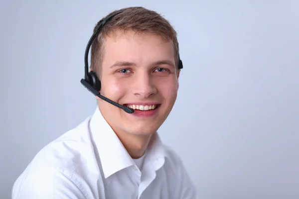 Operador de atención al cliente con auriculares aislados sobre fondo blanco — Foto de Stock