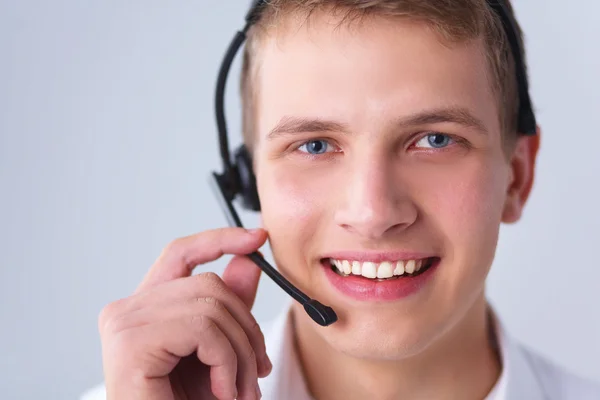 Customer support operator with a headset isolated on white background — Stock Photo, Image