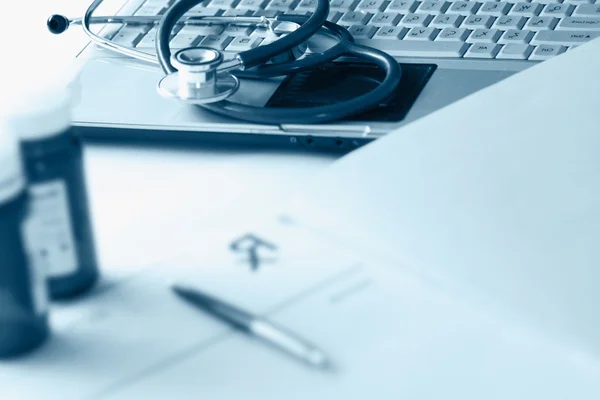 Bottle with laptop — Stock Photo, Image