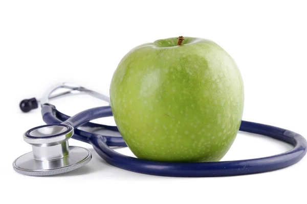 Stéthoscope et pomme verte isolés sur fond blanc — Photo