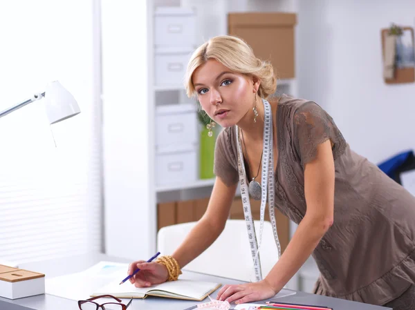 Modern young fashion designer working at studio. — Stock Photo, Image