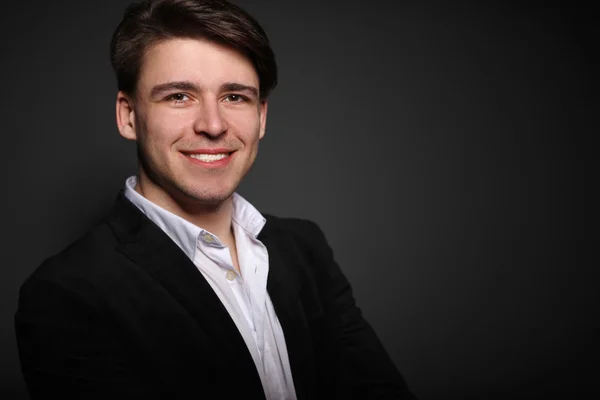 Portrait of a handsome young man on black background — Stock Photo, Image