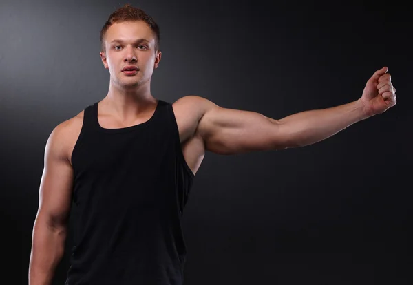 Jovem musculoso saudável. Isolado em preto — Fotografia de Stock