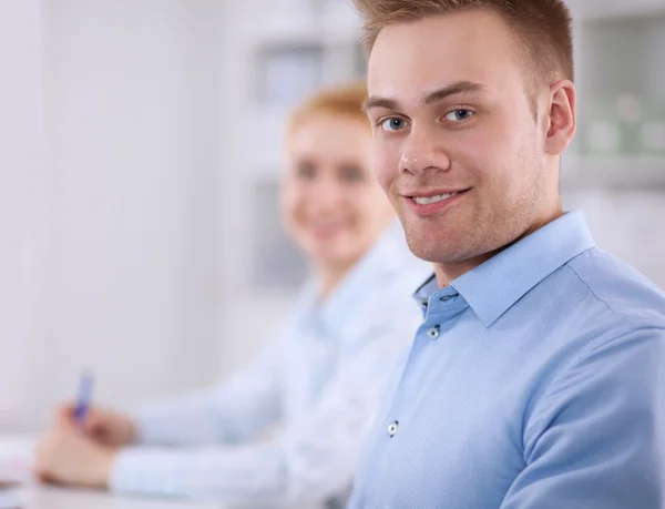 Business people sitting and discussing at business meeting, in office — Stock Photo, Image