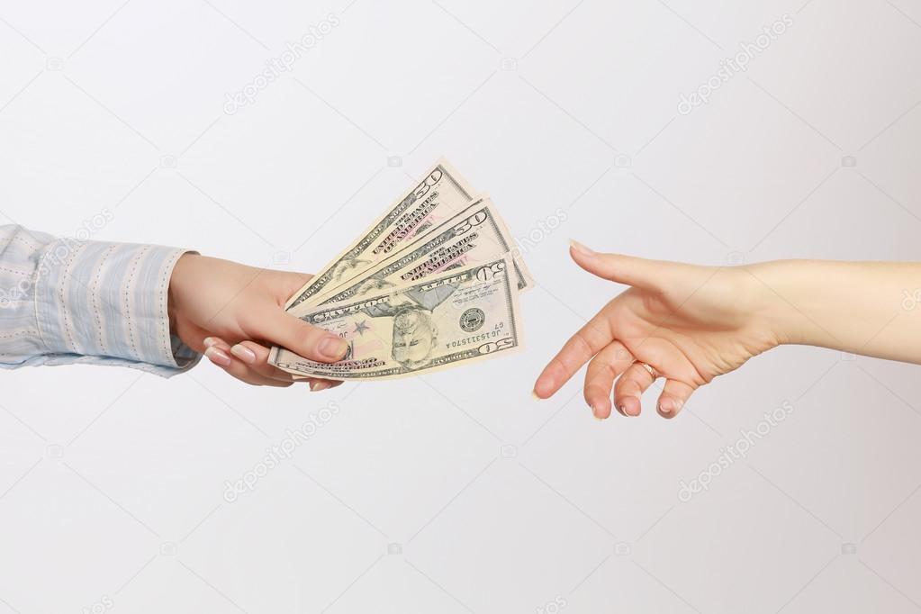 Money on the hands, isolated on white background