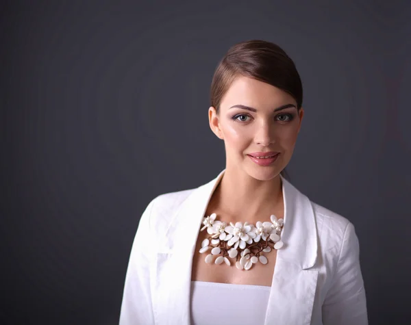 Portrait of young woman with beads, isolated on grey background — ストック写真