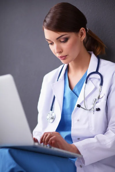 Female doctor working isolated on grey  background — Stock Photo, Image