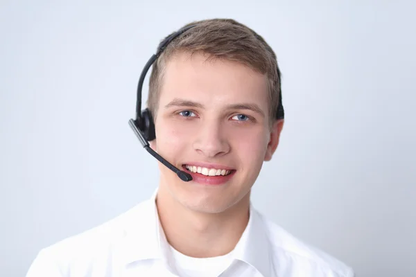 Kundsupport operatören med ett headset på vit bakgrund — Stockfoto