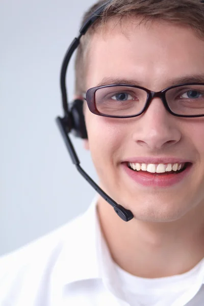 Opérateur de support client avec un casque sur fond blanc — Photo