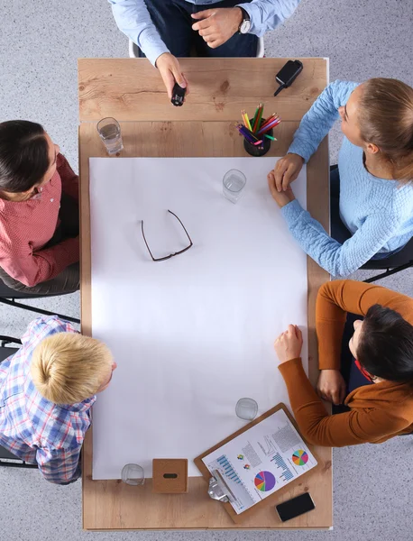 Business people sitting and discussing at business meeting, in office — Stock Photo, Image