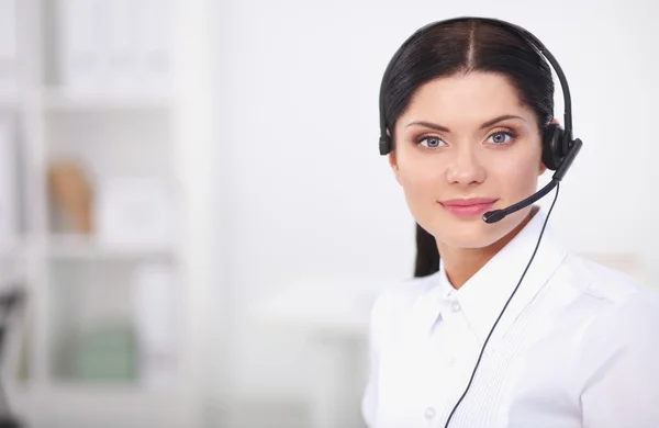 Close-up portrait of a customer service agent sitting at office — Stock Photo, Image