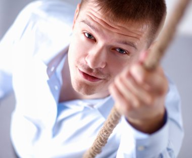 İpi yukarı artan işadamı görüntüsü