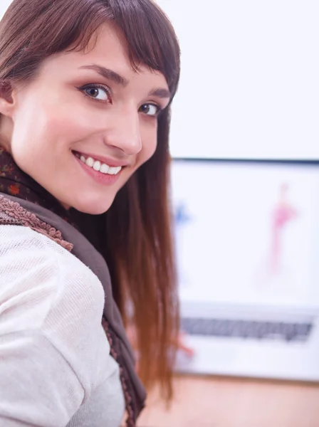 Portrait of attractive female fashion designer sitting at office desk — Stock Photo, Image