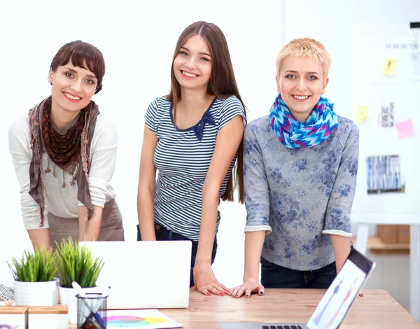 Group of fashion designers discussing designs in a studio — Stock Photo, Image