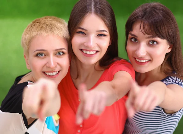 Three happy girls pointing fingers at you choosing — Stock Photo, Image