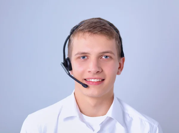 Klantenondersteuning operator met een headset op witte achtergrond — Stockfoto