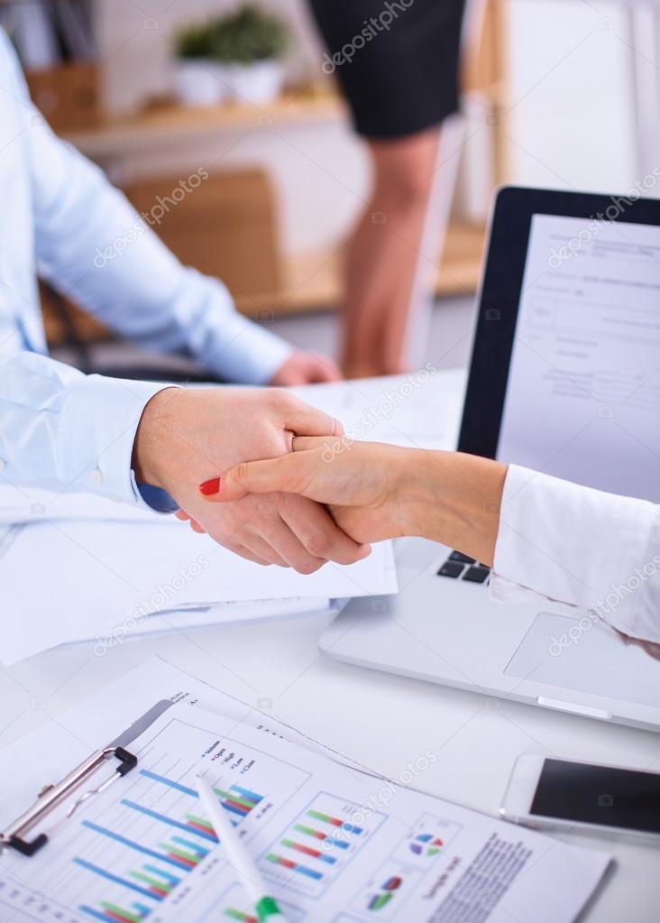 Business people shaking hands, finishing up a meeting