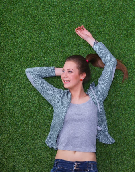 Relaxed woman  lying on the grass — Stock Photo, Image