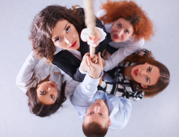 Image of businesspeople  ascending up the rope — Stock Photo, Image