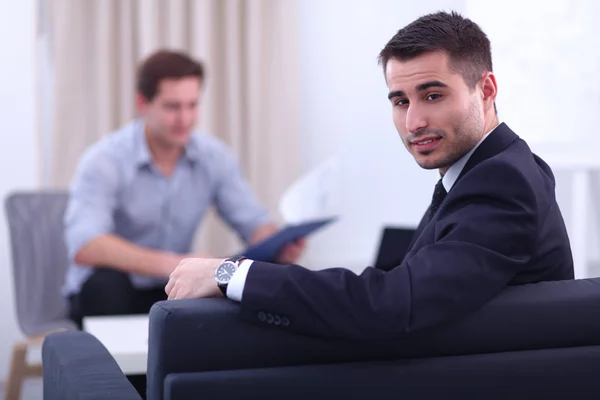 Business people sitting and discussing at business meeting, in office — Stock Photo, Image