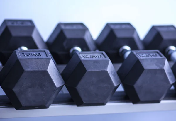 Sports dumbbells in modern sports club — Stock Photo, Image