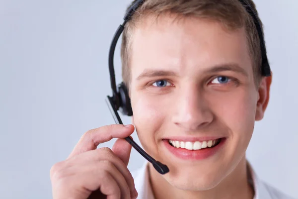 Customer support operator with a headset on white background — Stock Photo, Image