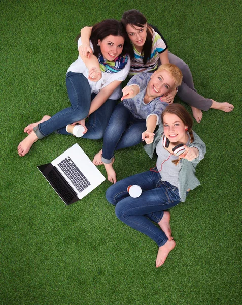 Group of young student using laptop together — Stock Photo, Image