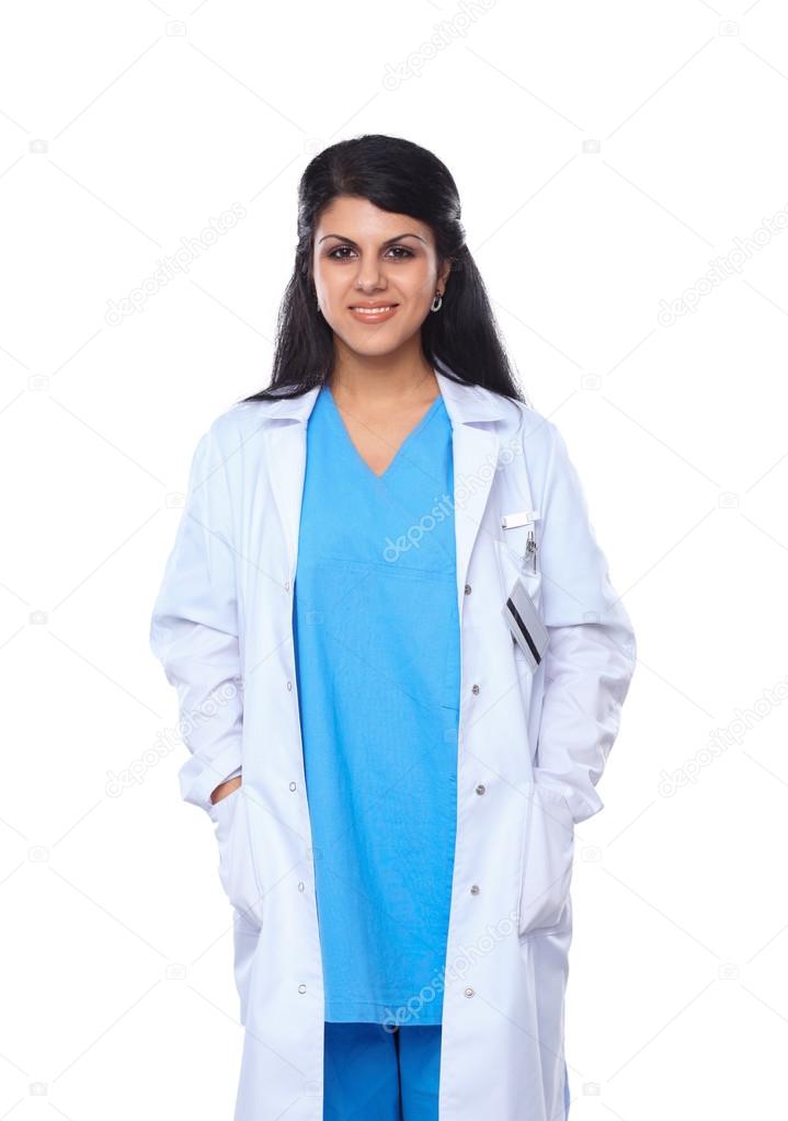 Doctor woman with stethoscope standing near wall
