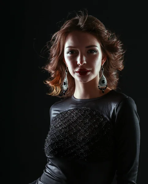 Portrait of beautiful brunette woman in black dress — Stock Photo, Image