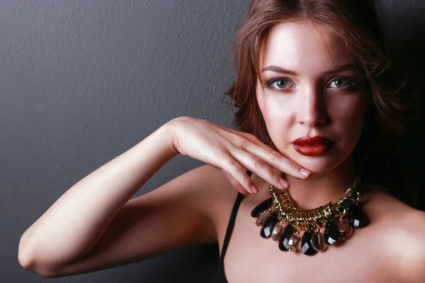 Portrait of young beautiful woman with jewelry — Stock Photo, Image