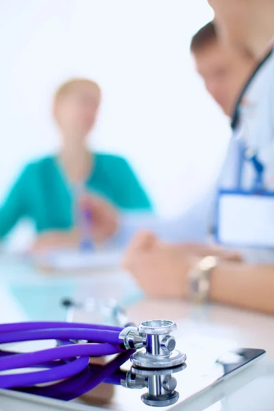 Young female doctor sitting at the desk — Stock Photo, Image