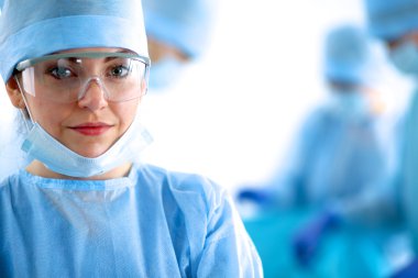 Female surgery in the operating room clipart