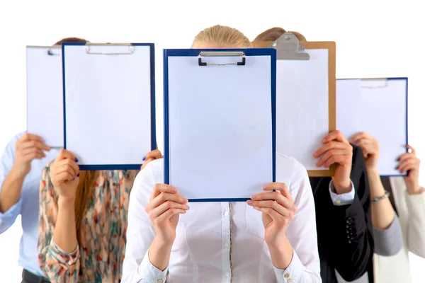 Team of businesspeople holding a folders near face isolated on white background — Stock Photo, Image