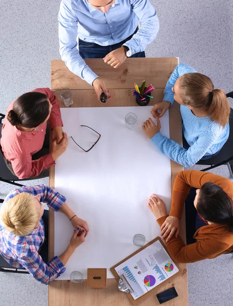 Business people sitting and discussing at business meeting, in office — Stock Photo, Image