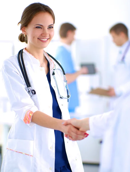 Young medical people handshaking at office — Stock Photo, Image