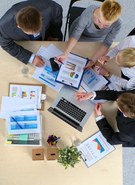 Business people sitting and discussing at business meeting, in office — Stock Photo, Image