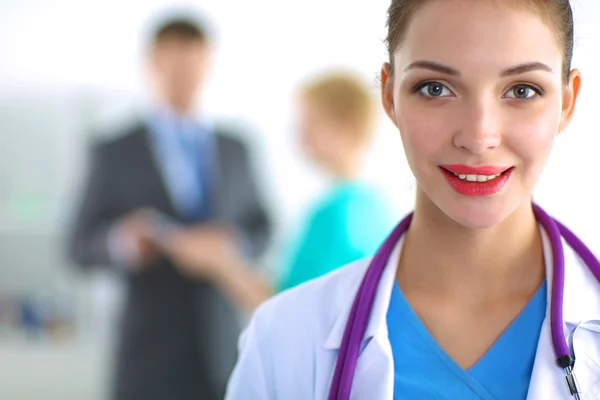 Woman doctor standing with stethoscope at hospital — Stock Photo, Image