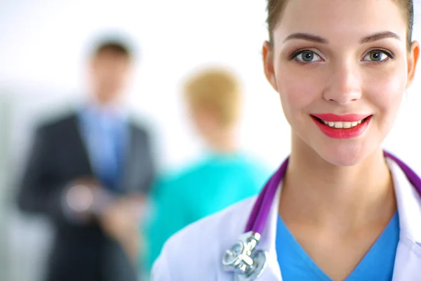 Woman doctor standing with stethoscope at hospital — Stock Photo, Image