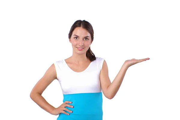 Portrait of a smiling young woman pointing up — Stock Photo, Image