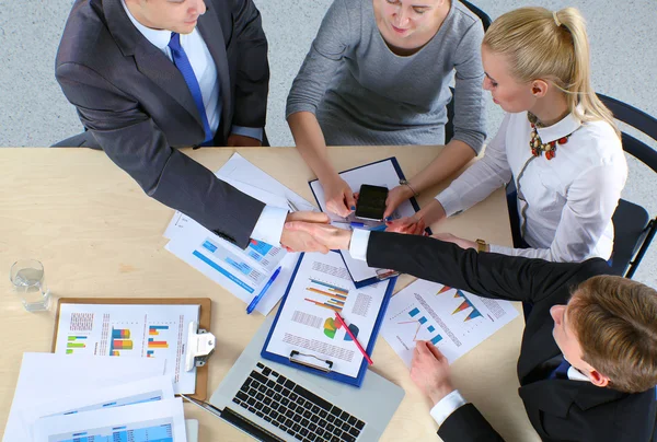 Business people handshake, sitting at the table Stock Image