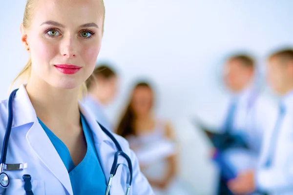 Woman doctor standing with stethoscope at hospital — Stock Photo, Image