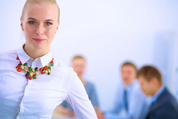 Portrait of a young woman working at office standing with folder — Stock Photo, Image