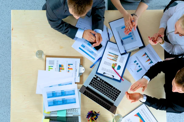 Business people sitting and discussing at business meeting, in office — Stock Photo, Image