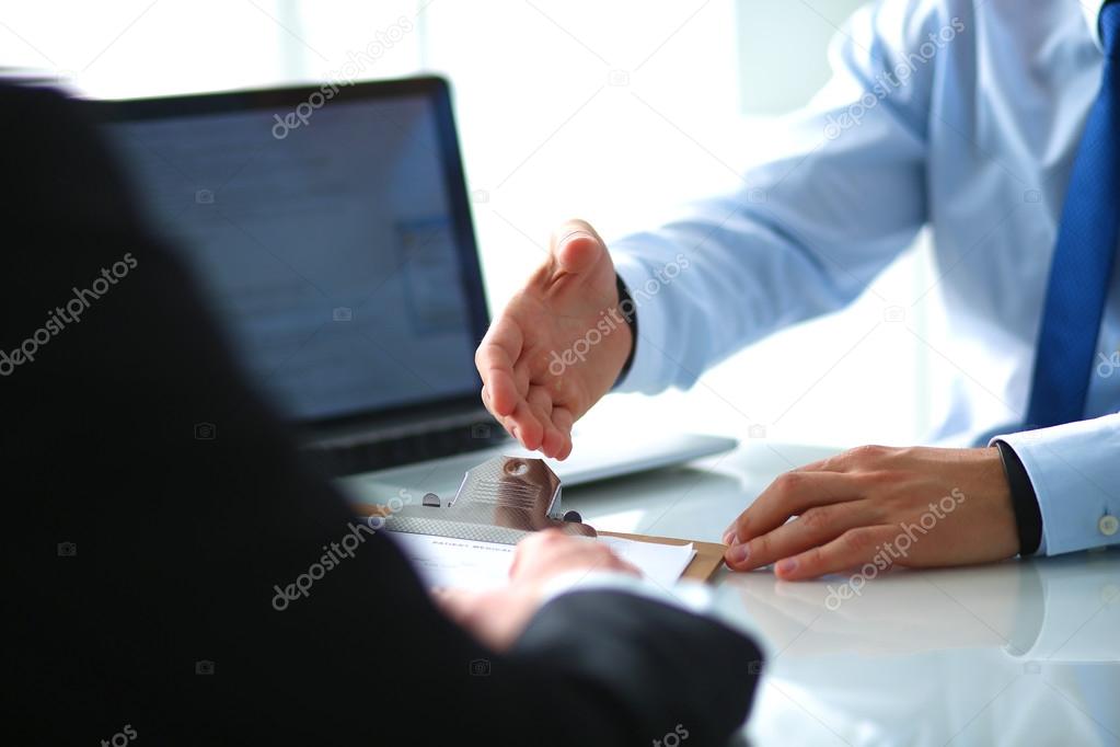 Business people shaking hands, finishing up a meeting