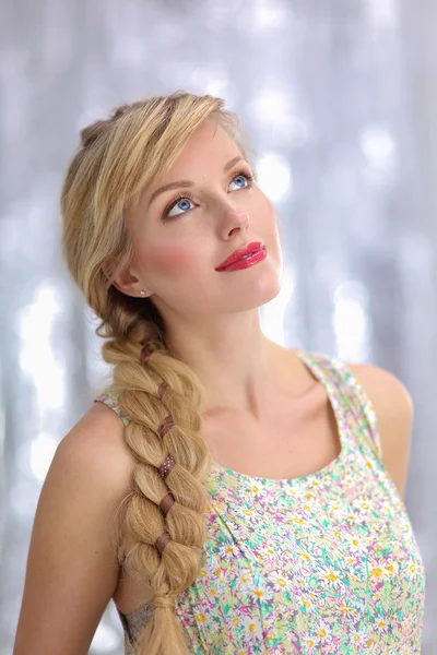 Beautiful blonde young woman with braid hairdo — Stock Photo, Image